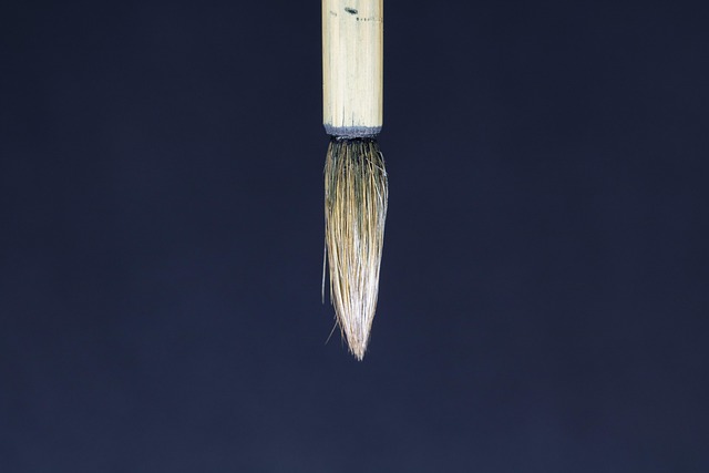 Hand writing calligraphy strokes on cotton paper